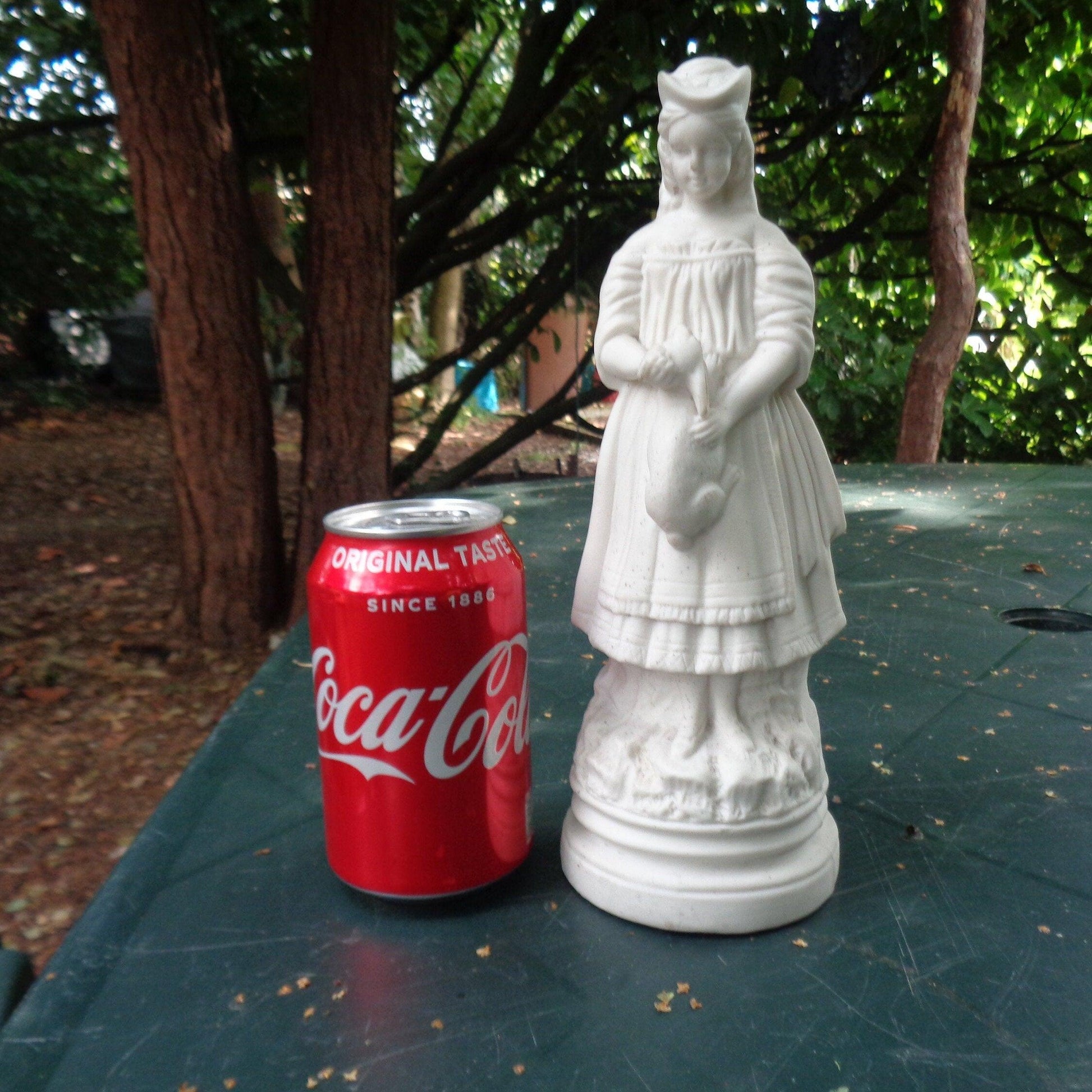 Biscuit porcelain figure of a Victorian girl with rabbit