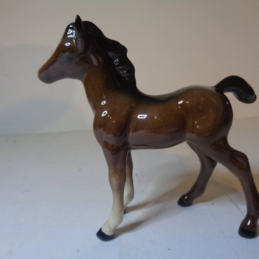 Beswick brown foal with black back stripe and white front socks