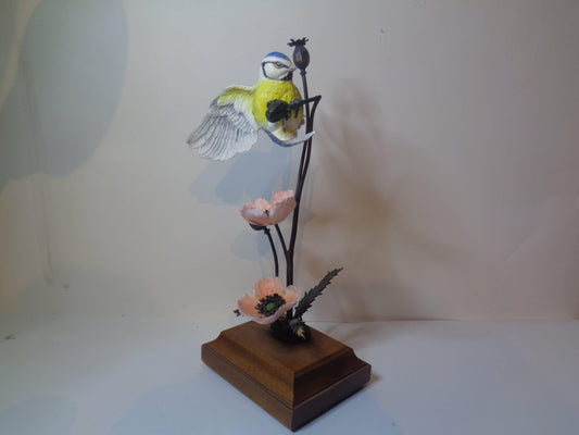 Blue Tit on a Bronze Poppy on Wooden Base