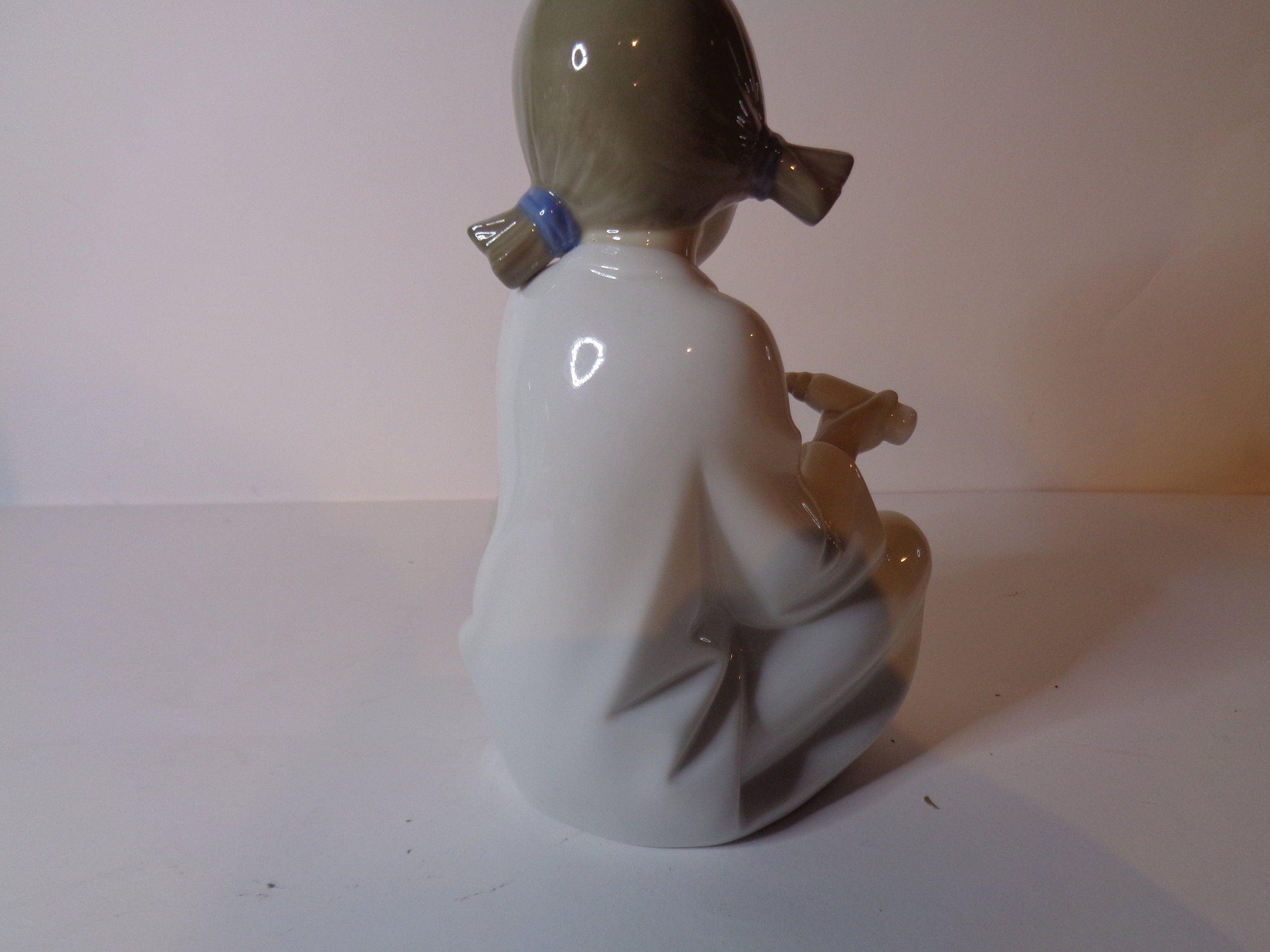 NAO by Lladro Young Shepherdess bottle feeding a lamb