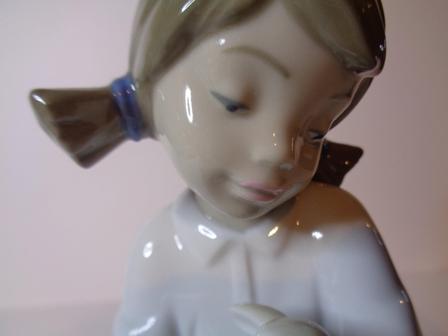 NAO by Lladro Young Shepherdess bottle feeding a lamb