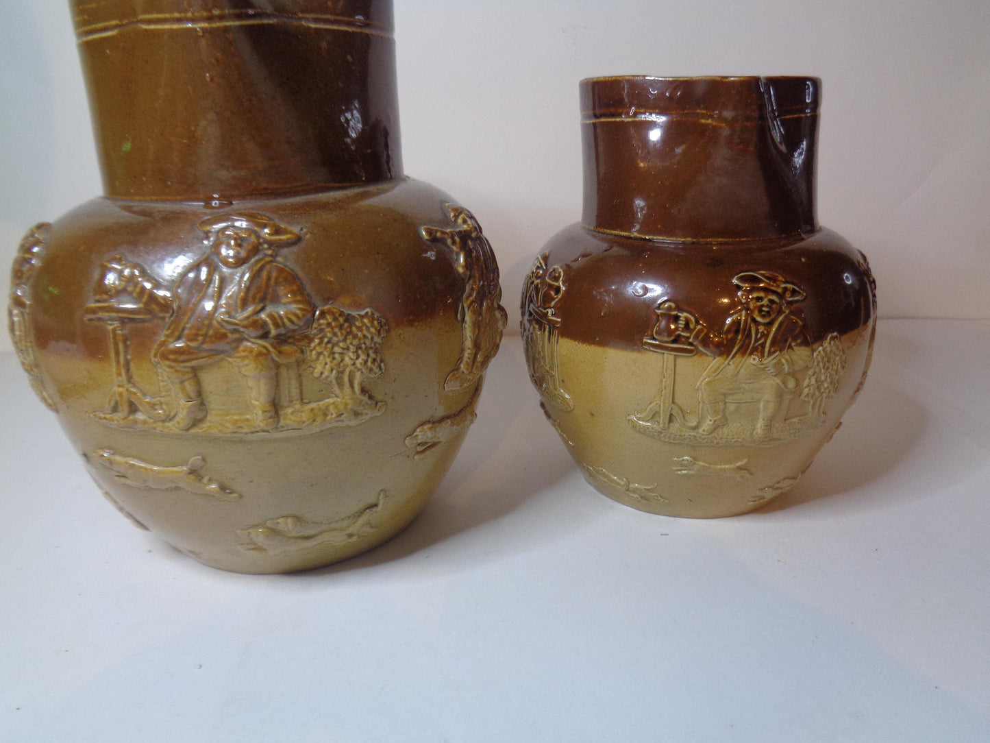 Doulton Lambeth Pair Salt Glazed Harvest Pattern Jugs