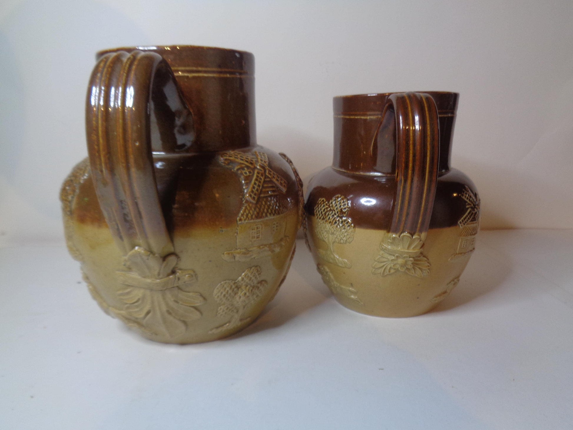 Doulton Lambeth Pair Salt Glazed Harvest Pattern Jugs