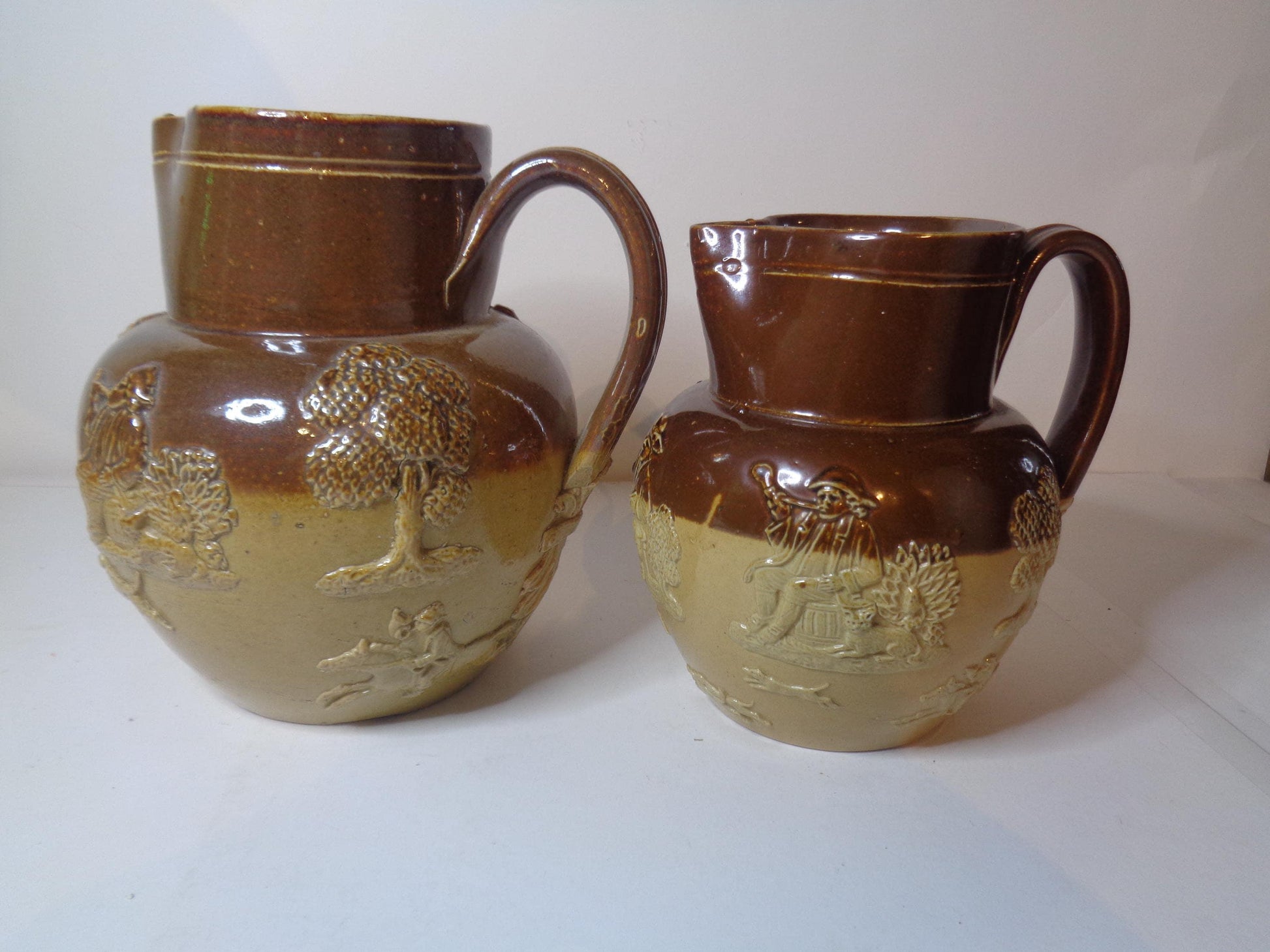 Doulton Lambeth Pair Salt Glazed Harvest Pattern Jugs