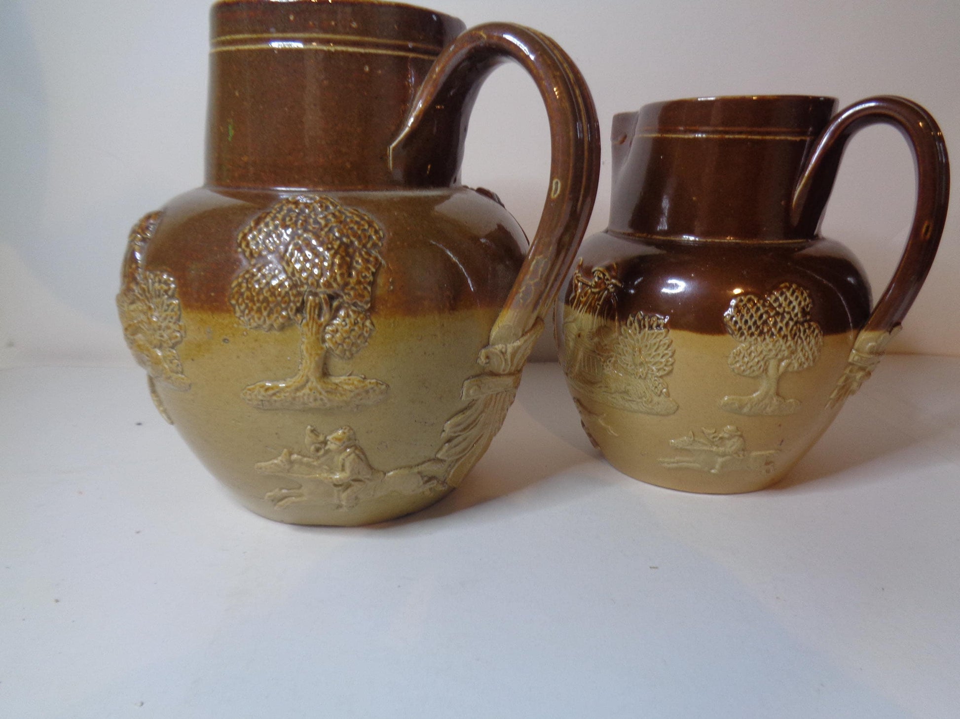 Doulton Lambeth Pair Salt Glazed Harvest Pattern Jugs