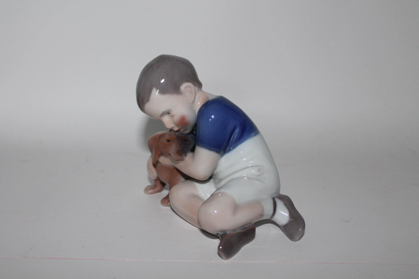 Royal Copenhagen Bing and Grondahl Boy with Dachshund No 1951