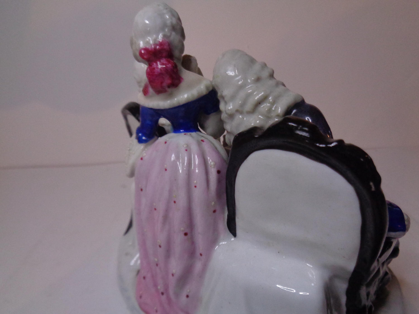 Dresden porcelain figure group featuring a gentleman and lady playing chess