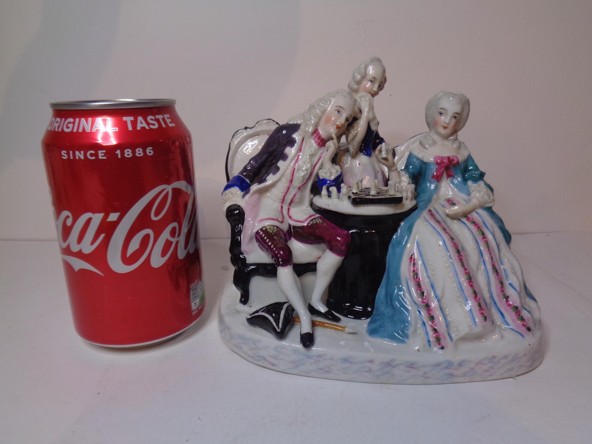 Dresden porcelain figure group featuring a gentleman and lady playing chess