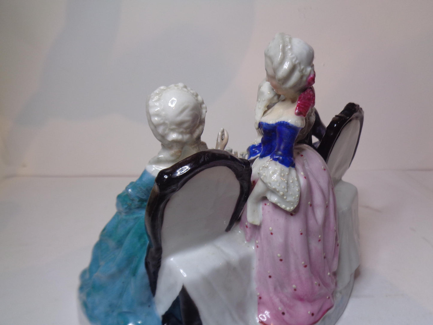 Dresden porcelain figure group featuring a gentleman and lady playing chess