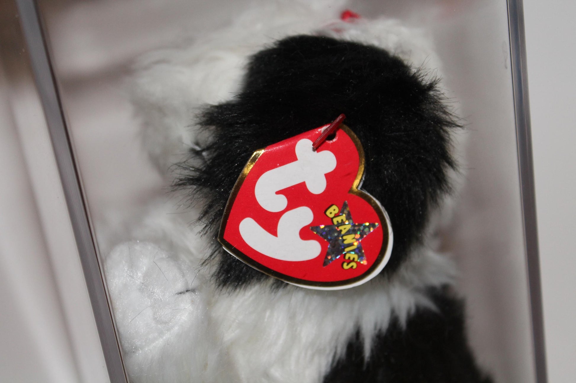 Ty Poofie™ Beanie baby in storage box